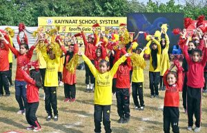 Secretary Workers Welfare Fund Zulfiqar Ahmad joins students holding torches to kick off the opening ceremony of Kaiynaat School System’s Annual Sports Gala 2025 at Sector I-10.