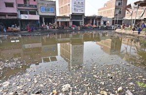 Sewerage water accumulated at a vegetable market causes inconvenience to shopkeepers and visitors.