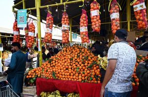 A vendor selling fresh vegatables at weekly Sunday bazar Aabpara in the Federal Capital