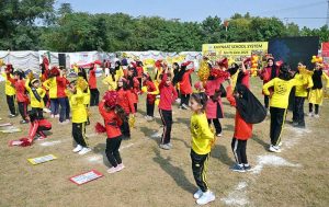 Secretary Workers Welfare Fund Zulfiqar Ahmad joins students holding torches to kick off the opening ceremony of Kaiynaat School System’s Annual Sports Gala 2025 at Sector I-10.