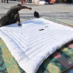 A worker is busy stitching a quilt for a customer at his workplace in Sector G-7 of the Federal Capital