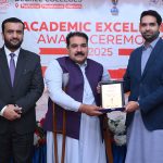 Executive Director strategy and Coordination City University Science & Information Technology Muhammad Ayoub Sethi presenting a shield to Secretary Mardan Board Prof. Hazrat Ali during Academic Excellence Award Ceremony 2025 of PMDC