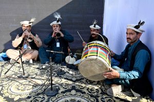A girl visits a stall at the Ten-Day annual folk festival “Lok Mela 2025” at Lok Virsa