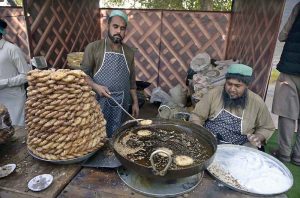 A large number of people are visiting the different stalls setup during Lok Mela-2025 at Lok Virsa.