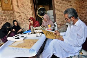 A painter trains his students in traditional calligraphy and painting during the art classes inside the historic Wazir Khan Mosque, keeping centuries-old artistic heritage alive.