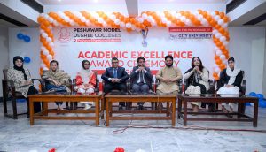 Executive Director strategy and Coordination City University Science & Information Technology Muhammad Ayoub Sethi presenting a shield to Secretary Mardan Board Prof. Hazrat Ali during Academic Excellence Award Ceremony 2025 of PMDC