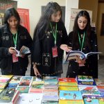 Girls visiting book stall at the inauguration of 10th Adab Festival