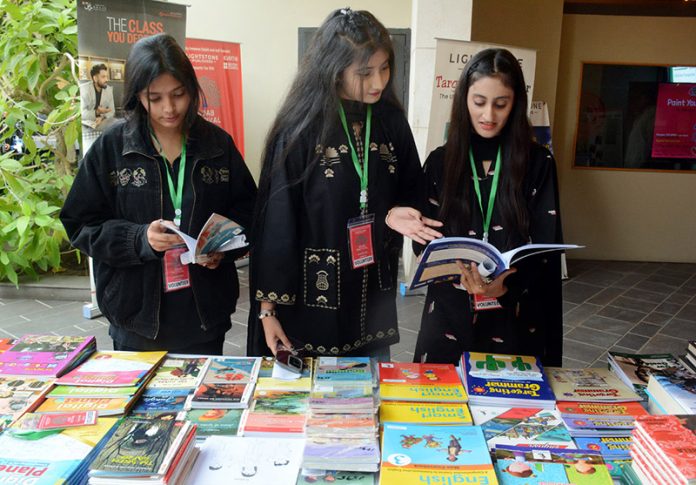 Girls visiting book stall at the inauguration of 10th Adab Festival