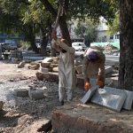 Labourers busy in construction work at Melody Food Street