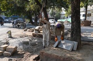 Labourers busy in construction work at Melody Food Street