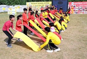 Secretary Workers Welfare Fund Zulfiqar Ahmad joins students holding torches to kick off the opening ceremony of Kaiynaat School System’s Annual Sports Gala 2025 at Sector I-10.