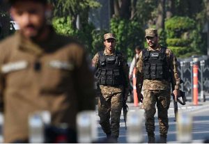 Security personnel maintain a vigilant watch outside the Rawalpindi Cricket Stadium as crowds gather for the high-energy second One Day International between Pakistan and Sri Lanka.
