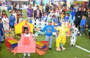 Students of different government primary schools performing in tableau during function "Early Childhood Talent Show and Fair Little Minds Big Dreams" organized by District Education Officer Primary.
