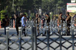 Security personnel maintain a vigilant watch outside the Rawalpindi Cricket Stadium as crowds gather for the high-energy second One Day International between Pakistan and Sri Lanka.