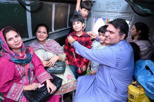 Families of hindu community boarding a special train heading to Lahore to attend the 556th birth anniversary celebrations of Guru Nanak Dev Ji in Nankana Sahib.