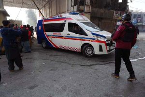 Rescue and security personnel collect evidence at the scene of a suicide attack on the Federal Constabulary headquarters, where three FC soldiers were killed and 11 civilians injured