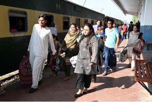 Families of hindu community boarding a special train heading to Lahore to attend the 556th birth anniversary celebrations of Guru Nanak Dev Ji in Nankana Sahib.