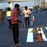 NHA staff install a zebra crossing with a pedestrian-friendly barrier to ensure smooth traffic flow along Walton Road.