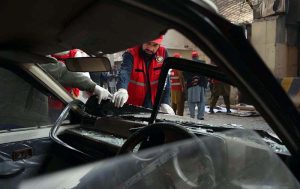 Rescue and security personnel collect evidence at the scene of a suicide attack on the Federal Constabulary headquarters, where three FC soldiers were killed and 11 civilians injured