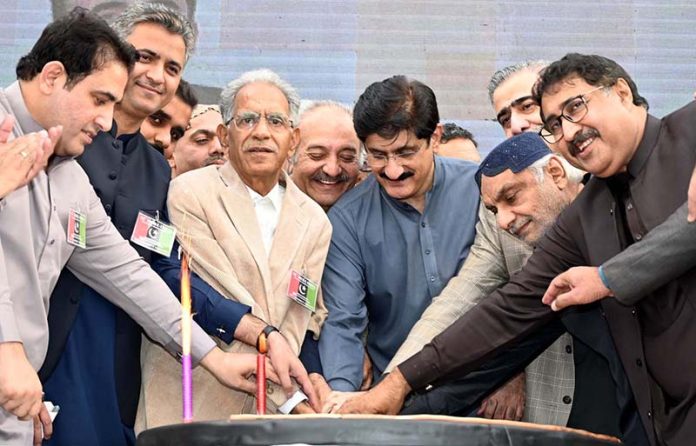 Chief Minister Sindh Syed Murad Ali Shah cuts the cake with others on the occasion of the 58th Foundation Day of the Pakistan People’s Party at Municipal Stadium