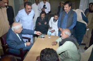 Federal Minister for Investment Board Qaiser Ahmad Sheikh talks to the media after holding an open court at his dera.