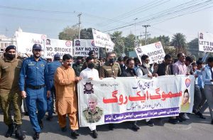 CTO Javed Nasir is leading an awareness walk about smog at District Council Chowk.