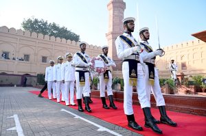 Commander Central Punjab, Rear Admiral Sohail Ahmed Azmie steps forward at Mazar-e-Iqbal to lay floral wreath during change of guard ceremony to pay homage to the national poet, Allama Muhammad Iqbal on his 148th birthday anniversary