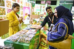 Woman reviewing the products under display at various stalls set at the 3rd International Food and Agriculture Exhibition FoodAg 2025, organized by Trade Development Authority of Pakistan from November 25 to 27 at Expo Center.