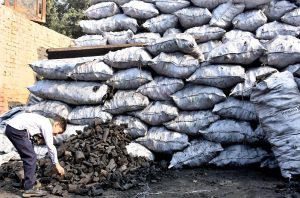 A child labors in a charcoal warehouse on International Children’s Day, drawing attention to the persistent issue of child labor in the province