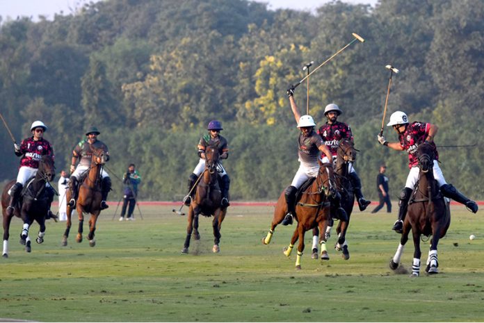 Players struggling to get hold on the ball during the final polo match playing between Master Paints and FG/Din Polo teams at Lahore Polo Club during LPC Polo Cup 2025. FG/Din polo team won by 8-6