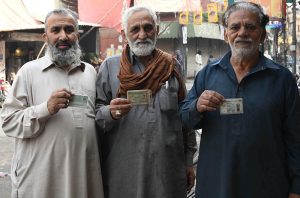 Police personnel stand alert during the by-election in National Assembly constituency NA-129 at Sodiwal