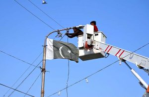 Town workers are busy installing street lights on the railway overhead bridge in the City.