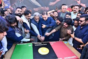Sindh Minister for Irrigation Jam Khan Shoro and others cut the cake during the 58th PPP Foundation Day at Dialdas Club