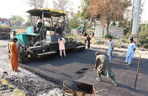 CDA workers carry out maintenance and carpeting work on the I-9 service road, ensuring smoother commutes in the federal capital.