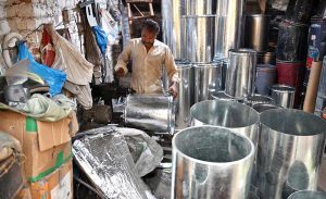 A worker making water geysers at his shop as demand rises with the onset of the winter season.