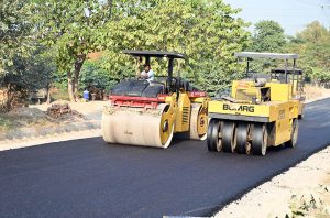 CDA workers carry out maintenance and carpeting work on the I-9 service road, ensuring smoother commutes in the federal capital.