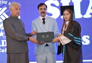 Defence Minister Khawaja Muhammad Asif distributes certificates and shields to successful students during the 14th convocation of Shadab Girls College