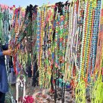 A roadside vendor displays animal ornaments for sale near the Bypass Road Livestock Market