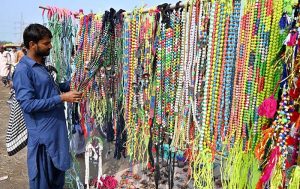 A roadside vendor displays animal ornaments for sale near the Bypass Road Livestock Market