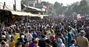 A large number of people purchasing warm sweaters and jackets in preparation of winter on Empress Road