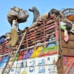 Labourers are busy loading the scrap onto truck