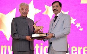 Defence Minister Khawaja Muhammad Asif distributes certificates and shields to successful students during the 14th convocation of Shadab Girls College