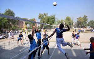 Volleyball players are in action during Annual Sports Tournament 2025 of Government Middle Schools District Peshawar.