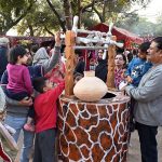 Families visit and explore cultural stalls during the ten-day annual folk festival “Lok Mela 2025” at Lok Virsa