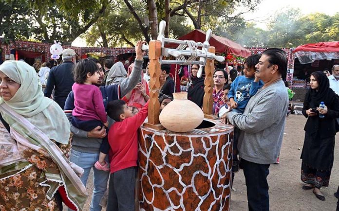 Families visit and explore cultural stalls during the ten-day annual folk festival “Lok Mela 2025” at Lok Virsa