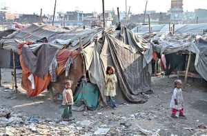 Labourers are busy loading the scrap onto truck