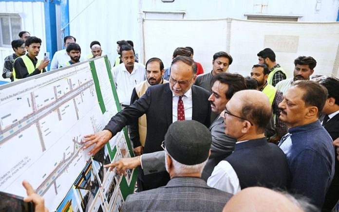 Federal Minister for Planning, Development and Special Initiatives Ahsan Iqbal receiving a briefing on the Green Line Project from officials