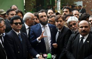 Minister for Information and Broadcasting, Attaullah Tarar talking to media persons outside court.