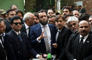 Minister for Information and Broadcasting, Attaullah Tarar talking to media persons outside court.