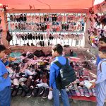 Students looking to buy used old shoes at old Bus Stand Road